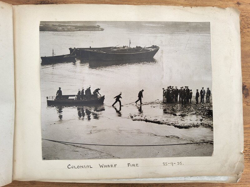 Colonial Wharf fire - rowing hose ashore