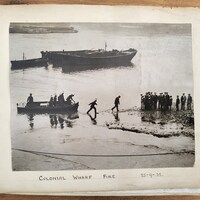 Colonial Wharf fire - rowing hose ashore
